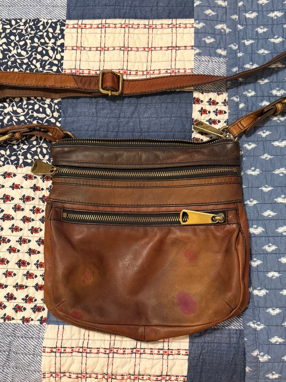 Vintage Fossil Genuine Leather crossbody bag with stains and water marks